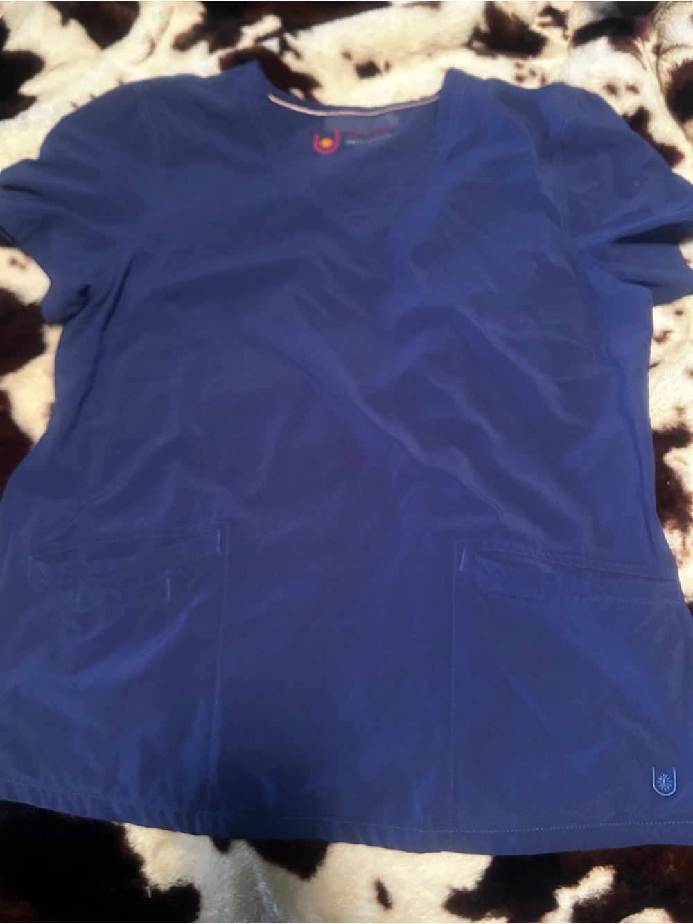 Urbane performance scrub top